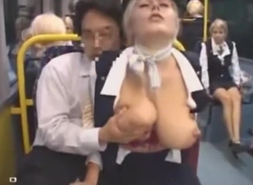Busty stewardess gives handjob on bus, takes cumshot