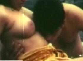 Indian beautiful young girl enjoys kissing on the boobs at the riverbed
