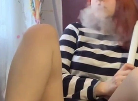 Redhead Girl with Racy Pussy Smokes a Shut up speak up and Caresses Her Pussy
