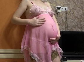 Pregnant milf fucks with dildo through panties and shakes inexperienced tits.